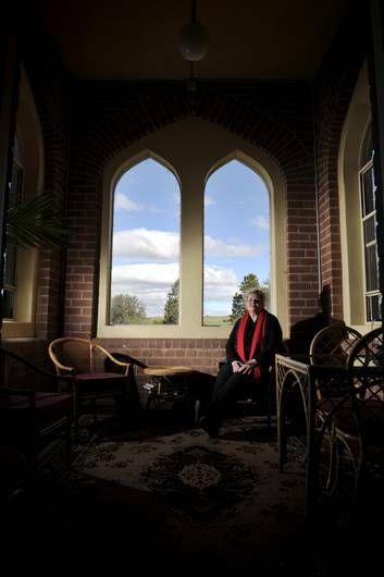 Manager of St Clements Retreat Cheryl Mongan sits in one of the private rooms that are available at the converted Monastery. Photo: Jay Cronan