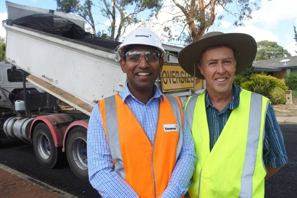 Downer manager Gana Varendran and ACT Roads maintenance manager Peter Thompson. Photo: Claudia Long