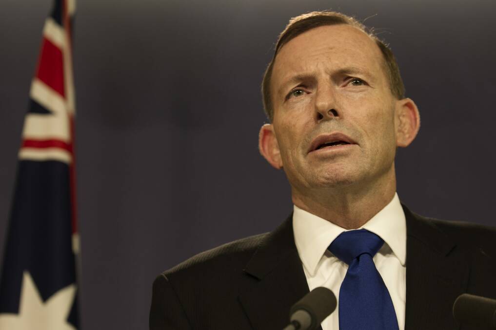 Tony Abbott addresses the media in Sydney on Sunday. Photo: Louie Douvis