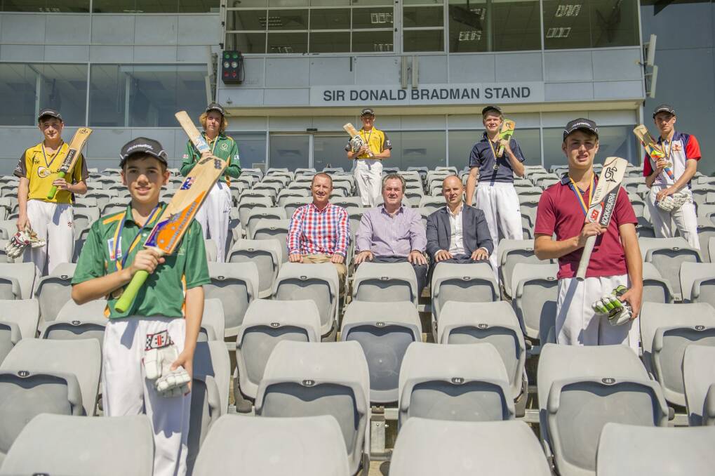 Brad Haddin presented seven ACT centurions with medals on Monday, and Owen Levings, front left, made the former Australian vice-captain jealous. Photo: Jay Cronan