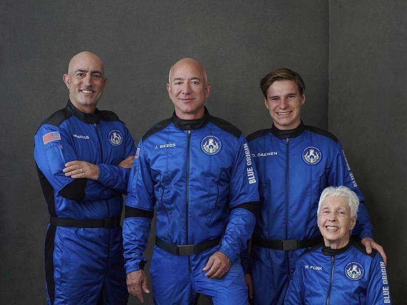 Jeff Bezos (centre left) and his crew are set to take off on their voyage to the edge of space.