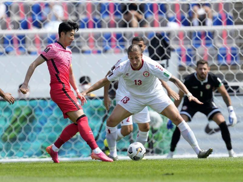 South Korea's Son Heung-min (L) helped clinch South Korea top spot in latest World Cup qualifying.