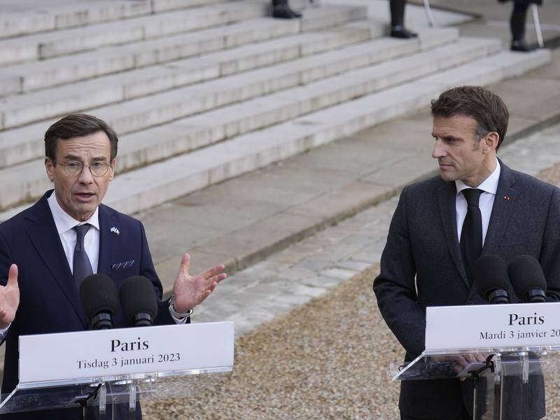 Swedish PM Ulf Kristersson wants more nuclear co-operation with French President Emmanuel Macron. (AP PHOTO)