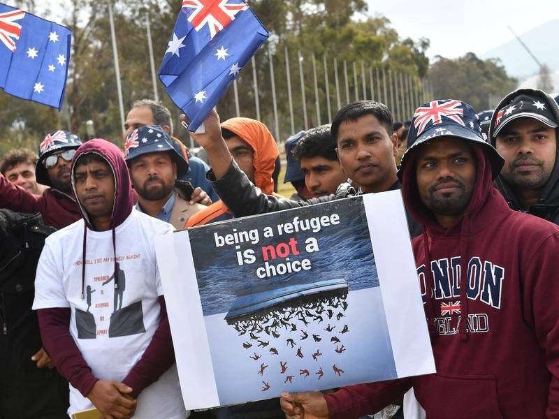 Hundreds of asylum seekers have rallied in protest at being on temporary visas for up to 8 years.