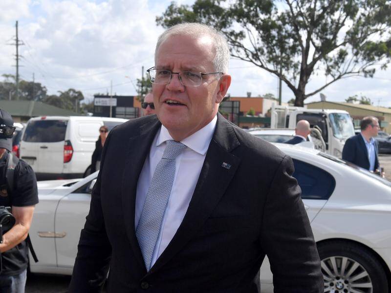 Scott Morrison has been confronted by an angry man at a media event in Sydney.