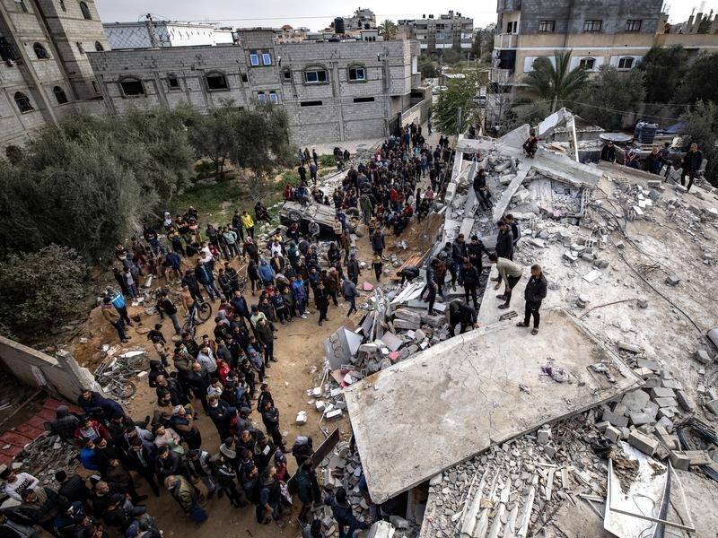 As peace talks falter, 14 members of one family were killed in a Rafah air strike. (EPA PHOTO)