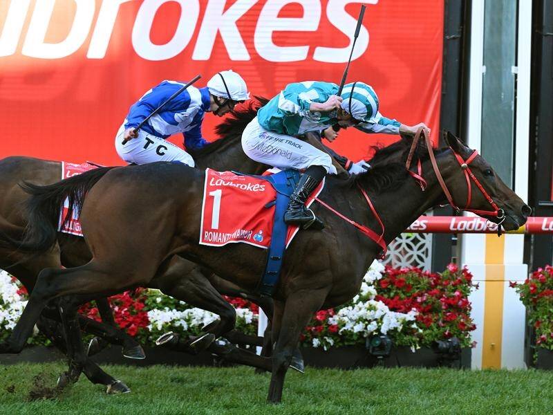 Romantic Warrior has surged to a Cox Plate victory in front of a huge crowd at Moonee Valley. (James Ross/AAP PHOTOS)