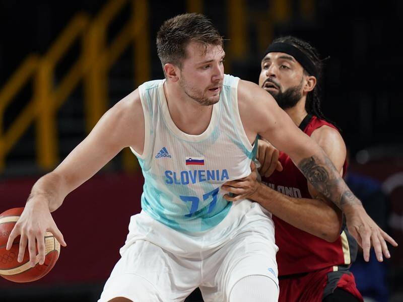 Luka Doncic has led Slovenia into the Olympic men's basketball semi-finals with a win over Germany.