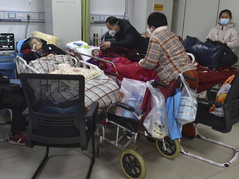 China has been reporting five or fewer COVID-19-related deaths a day since its policy U-turn. (AP PHOTO)
