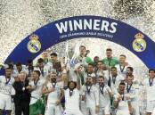 Real Madrid celebrate their Champions League final triumph over Liverpool.