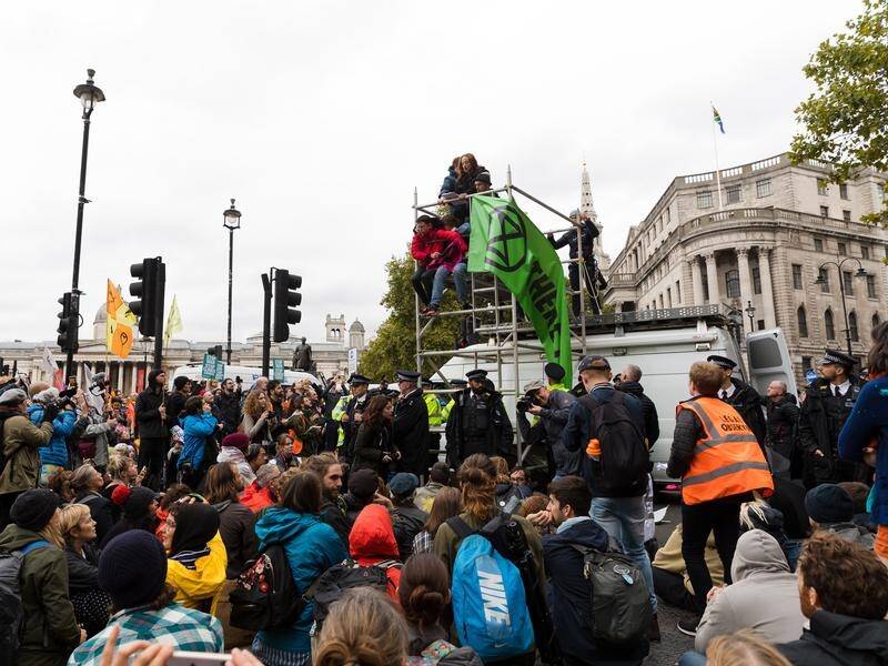 Police attempted to move on Extinction Rebellion protesters in London's Trafalgar Square.