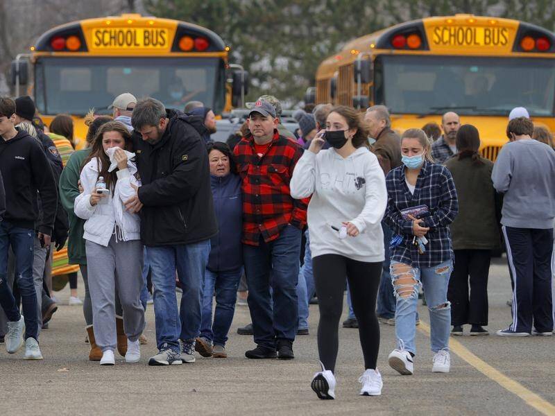 Parents rushed to collect their children after a shooting at Oxford High School in Michigan.