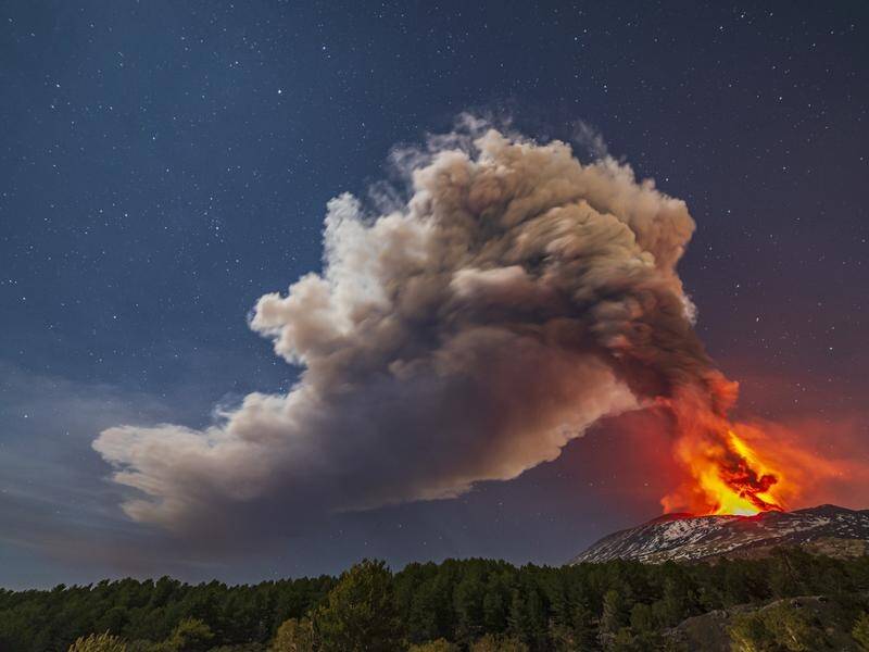Italy's Mount Etna has lit up the night sky with explosions and bright red molten lava.