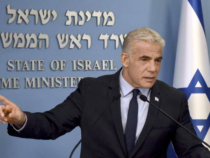 Israeli PM Yair Lapid says Iran would fund Israel's enemies if a new nuclear deal was signed. (AP PHOTO)