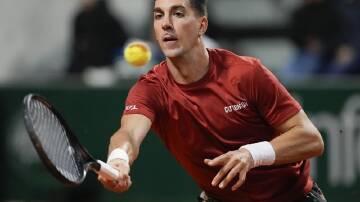 Thanasi Kokkinakis got embroiled in yet another late-night thriller before losing at Roland Garros. (AP PHOTO)