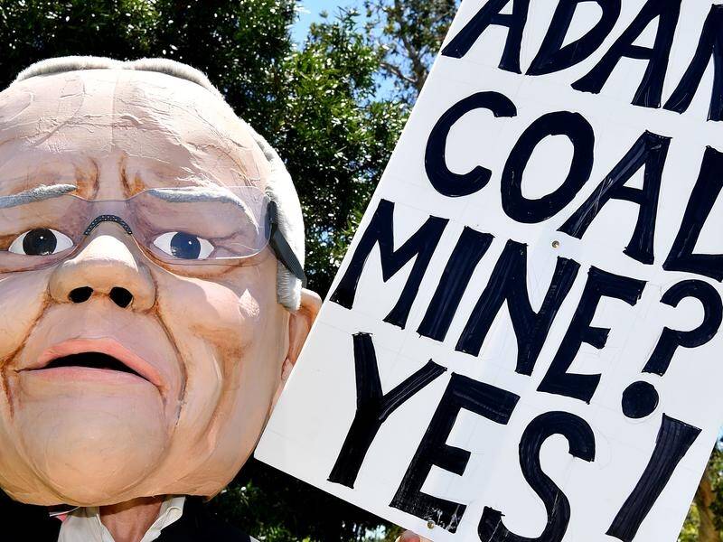 Queensland is under pressure to sign off on Adani after a groundwater plan got federal approval.