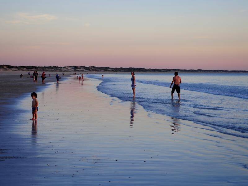 Broome's Cable Beach has reopened after a 58-year-old hotel worker was killed in a shark attack.