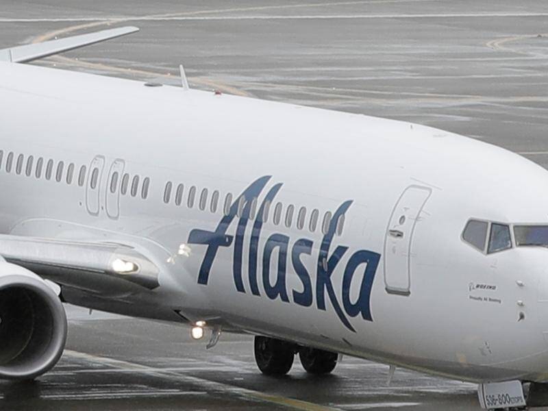 The off-duty pilot, 44, has been detained after the incident on an Alaska Airlines plane. (AP PHOTO)