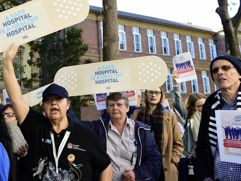 Health workers rallied outside Sydney's Royal Prince Alfred Hospital over workplace safety.