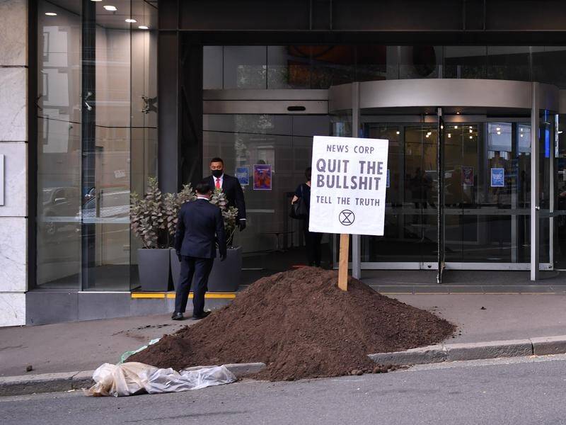 Extinction Rebellion protesters dumped manure outside News Corp's Sydney headquarters.