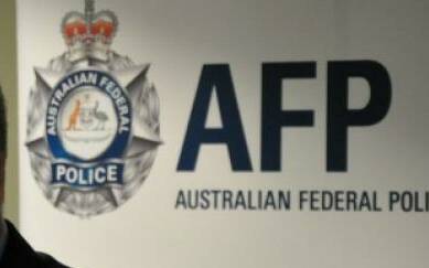 AFP officer and his twin brother charged with child exploitation offences
