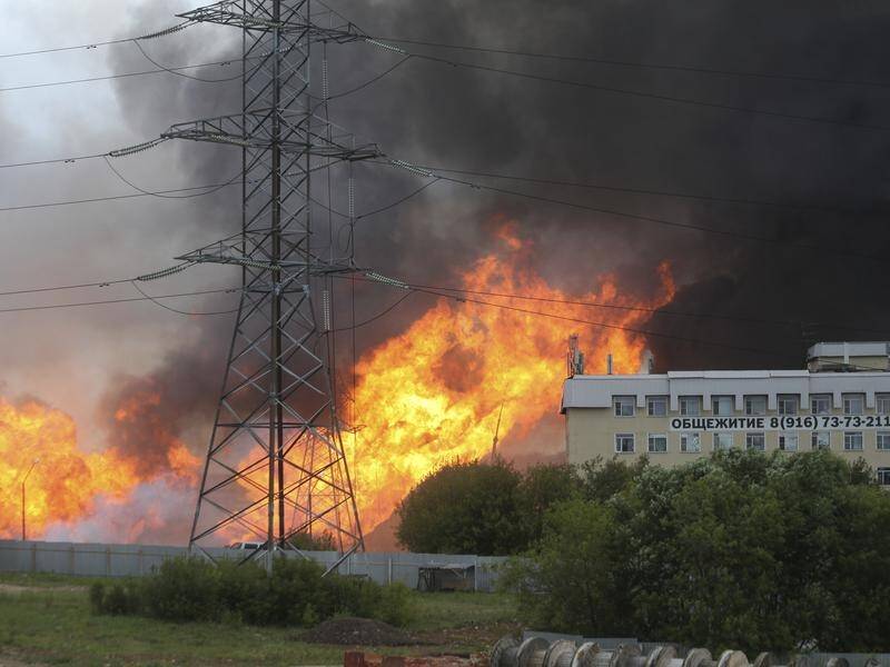 At least one person has been killed in a massive fire near a power station just outside Moscow.