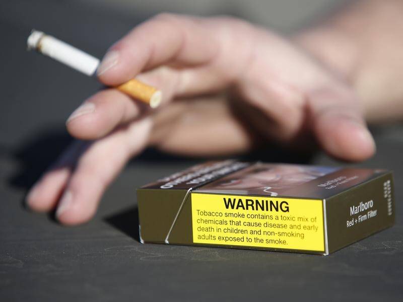 Smokers are encouraged to light up by cigarette vending machines, researchers say. (Regi Varghese/AAP PHOTOS)
