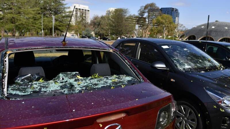 Buildings and hundreds of cars were damaged as hail the size of golf balls pelted Canberra.