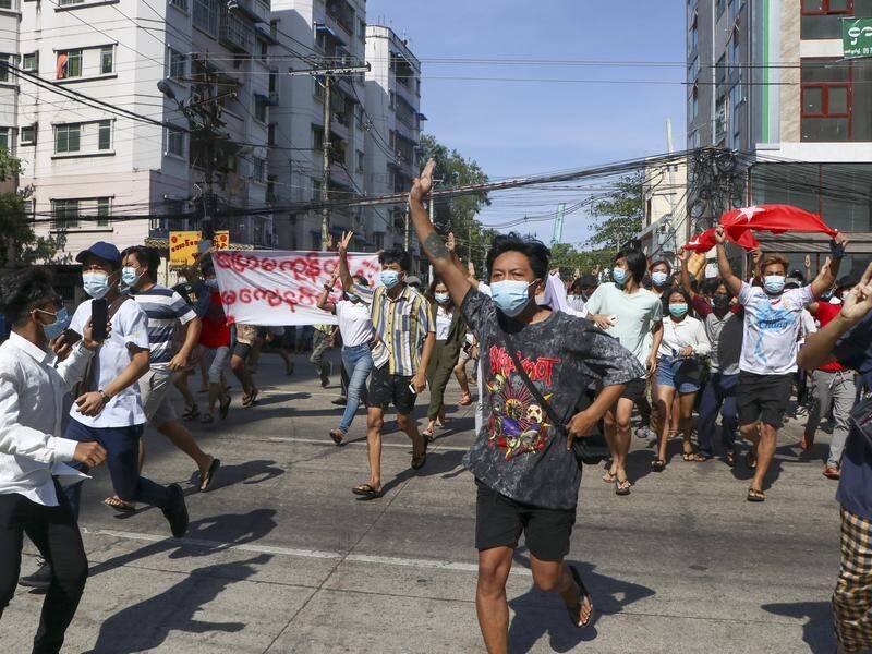 Anti-coup demonstrators have marched in Yangon and elsewhere against the country's military junta.