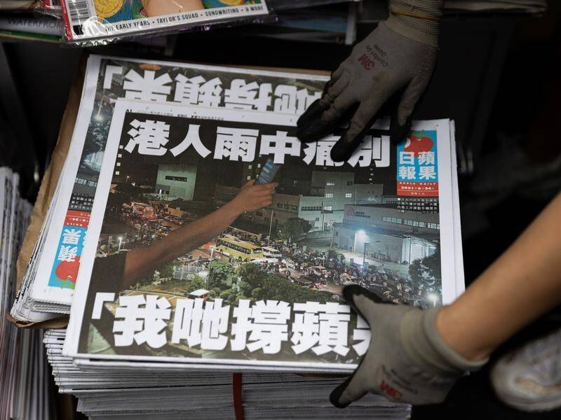 Hong Kong police have charged four journalists from the defunct Apple Daily with collusion.