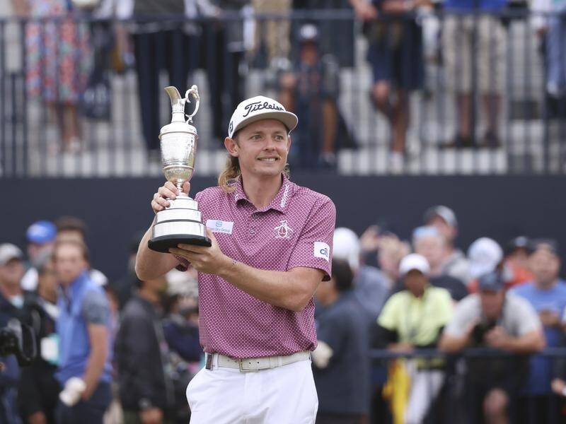 Cameron Smith holds the Claret Jug after his historic triumph in the 150th Open.