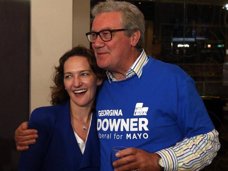 Liberal candidate Georgina Downer, with her father Alexander, after losing the Mayo by-election.