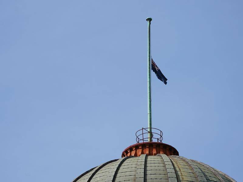 Flags are being flown at half-mast across Victoria in honour of four police officers who died.