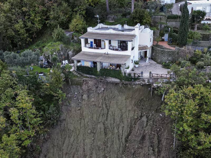 The death toll from the Ischia landslide rises to eight as experts point to illegally-built houses. (AP PHOTO)