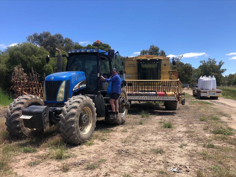 Tom Green is moving his farm machinery to higher ground as he awaits rising floodwaters in NSW.