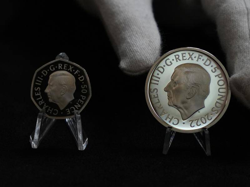 Charles appears on the new 50 pence coin and the new Stg5 commemorative coin. (AP PHOTO)