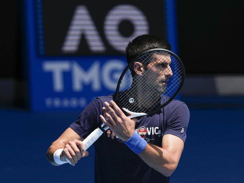 Novak Djokovic is focused on defending his Australian Open title, despite ongoing visa issues.