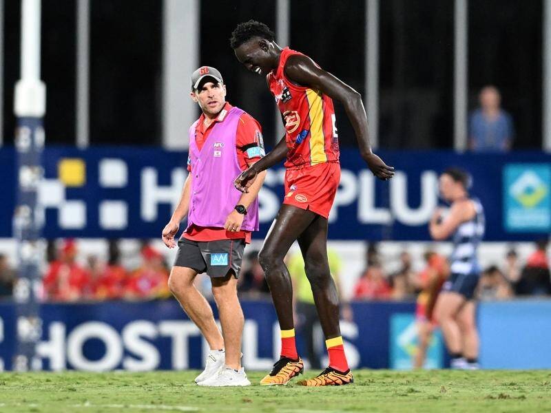 Gold Coast hope key defender Mac Andrew doesn't have a serious leg injury. (Darren England/AAP PHOTOS)