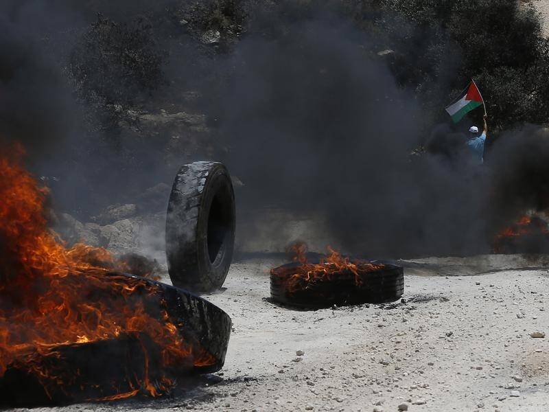 Palestinians and Israeli troops have clashed during a protest against a settlers' outpost at Nablus.
