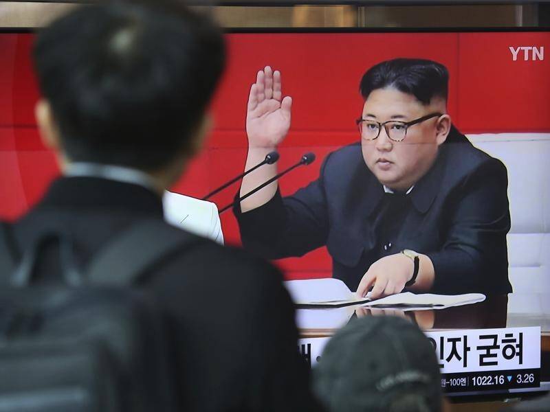 North Korean leader Kim Jong-un (R) has appeared to question his engagement with US President Trump.