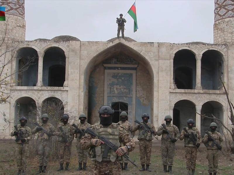 Azerbaijan's military says it has entered Agdam in Nagorno-Karabakh following a deal with Armenia.