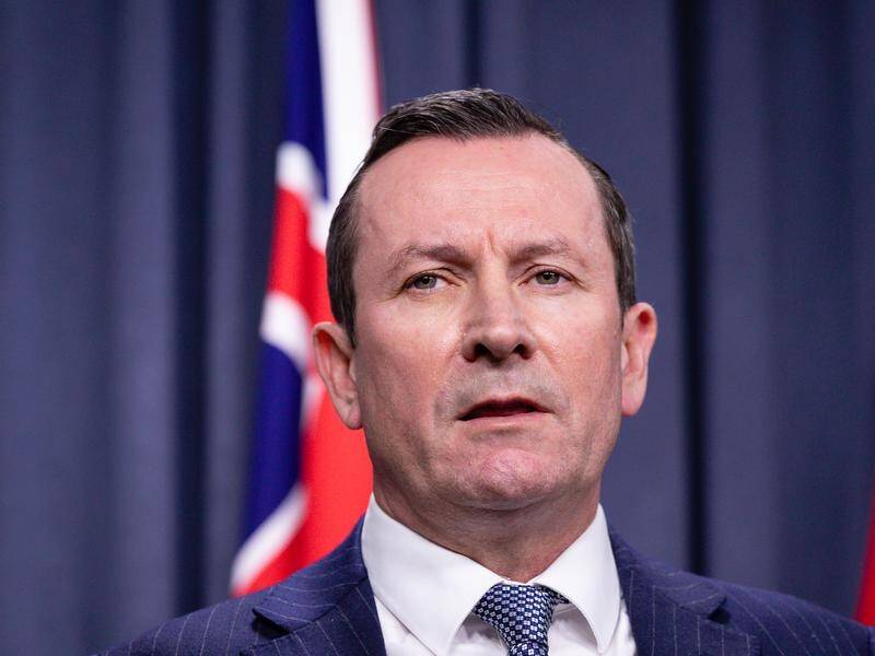 WA Premier Mark McGowan says a COVID-positive passenger isn't expected to impact the grand final.