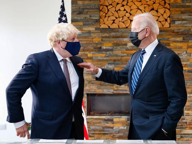 Boris Johnson (left) has joined US President Joe Biden in pledging vaccine doses for poor nations.