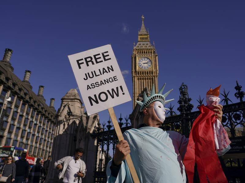Demonstrators have made a human chain around parliament in London to support Julian Assange. (AP PHOTO)