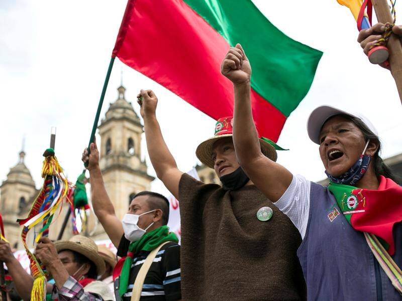 Protesters were joined indigenous people who visited Bogota demanding to see the president.