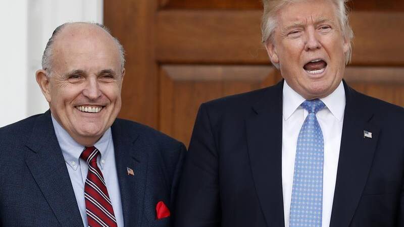 Former New York mayor Rudy Giuliani, left, is one of Donald Trump's legal team.