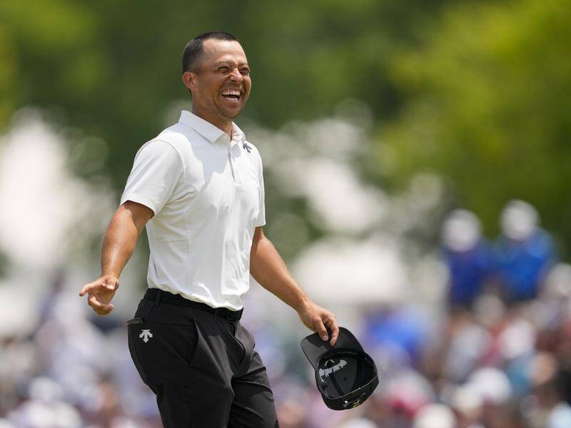 Xander Schauffele is all smiles after his record-breaking first-round of 62 at Valhalla. (AP PHOTO)