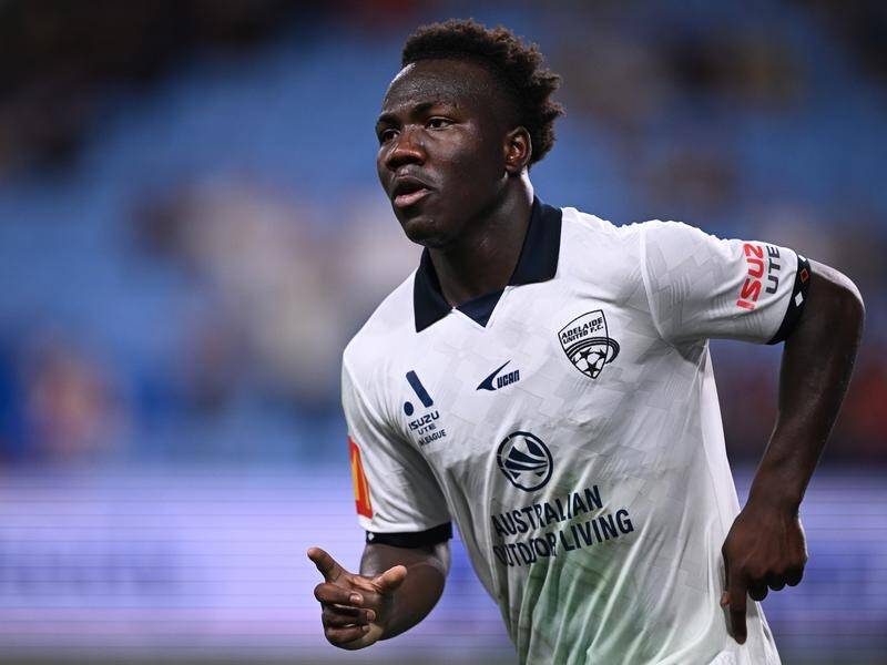 Teen sensation Nestory Irankunda has helped Adelaide United to a 4-2 win over Perth. (Dan Himbrechts/AAP PHOTOS)
