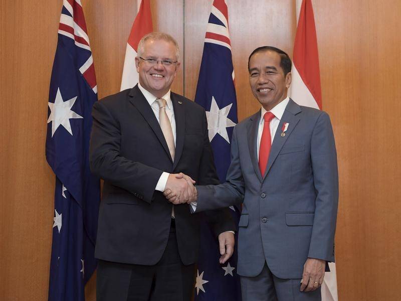 Indonesian President Joko Widodo (R) has signed-off on a lucrative trade agreement with Australia.