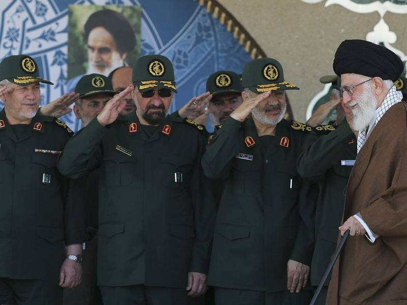Iranian Revolutionary Guard Mohsen Rezai (2nd from L) warns a British oil tanker could be seized.